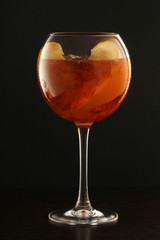 A glass with aperol spritz cocktail	