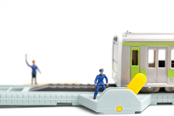 Miniature people : Railway staff are working at railway  on white background 