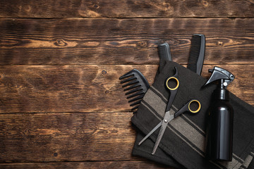 Hairdresser work table background with copy space. A various hairdressing tools such a hairbrushes,...