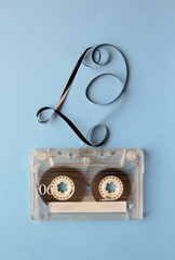 Vintage audio cassette tape on blue background