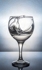 glass of water on gray background