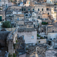 Fototapeta premium Sassi of Matera. Sasso Barisano at sunset. Magic of cave houses. UNESCO World Heritage Site.
