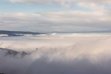 A view of St.Francis church in Assisi (Umbria, Italy) barely visible in the middle of fog