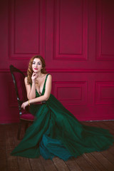 Woman in gorgeous green long evening chiffon dress, fashionable trend for ladies 