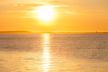 Quiet beautiful golden sunset on the sea. Summer nature background