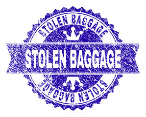 STOLEN BAGGAGE rosette stamp seal overlay with grunge texture. Designed with round rosette, ribbon and small crowns. Blue vector rubber watermark of STOLEN BAGGAGE title with corroded texture.