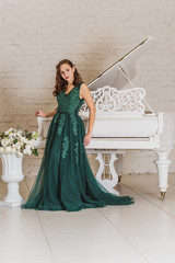 Woman in gorgeous green long evening chiffon dress, fashionable trend vintage chic for ladies 