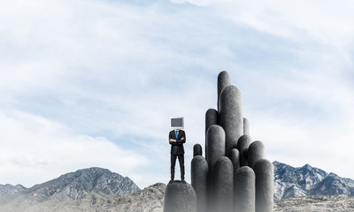 Businessman with monitor instead of head.