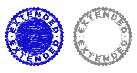 Obraz premium Grunge EXTENDED stamp seals isolated on a white background. Rosette seals with grunge texture in blue and grey colors. Vector rubber stamp imitation of EXTENDED text inside round rosette.