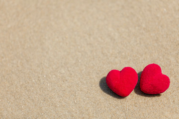 Fototapeta na wymiar red heart on the sand