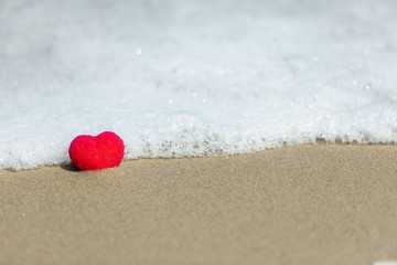 red heart on the sand