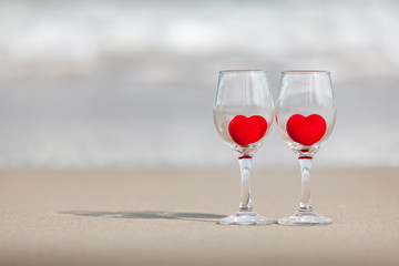 glass of wine on a red heart background