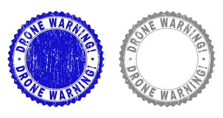 Grunge DRONE WARNING! stamp seals isolated on a white background. Rosette seals with grunge texture in blue and grey colors. Vector rubber watermark of DRONE WARNING! tag inside round rosette.
