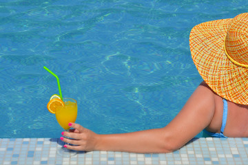 Real female beauty relaxing in swimming pool