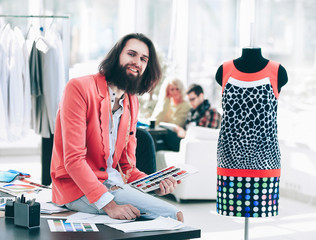 portrait of a fashion designer in a creative office
