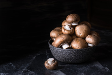 Harvest of mushrooms in plate. Selective focus. Royal champignon. Vegan. Vegetarian food, Vitamin. Healthy food. Process of cooking.