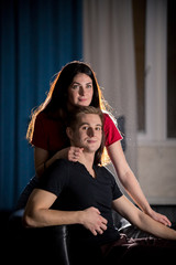 Young pretty couple sitting on a couch