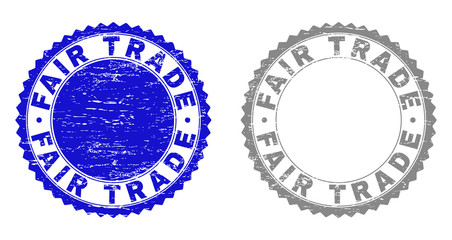 Grunge FAIR TRADE watermarks isolated on a white background. Rosette seals with grunge texture in blue and gray colors. Vector rubber stamp imprint of FAIR TRADE label inside round rosette.