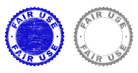 Grunge FAIR USE stamp seals isolated on a white background. Rosette seals with grunge texture in blue and gray colors. Vector rubber stamp imitation of FAIR USE text inside round rosette.