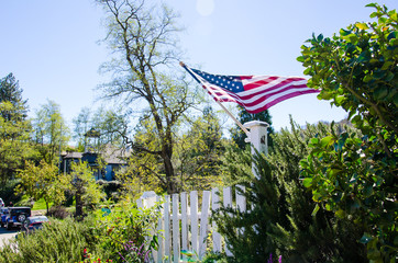 american flag in front of blue sky