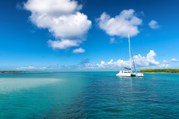 Catamaran mooring near Petite terre, Guadeloupe, French West Indies, blue sky background