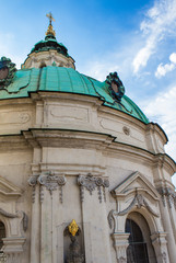 Fototapeta premium Tower of the Cathedral of St. Nicholas in Prague. Architecture of Prague old town
