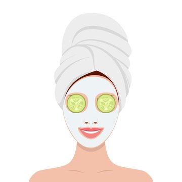 beautiful woman with facial mask of cucumber slices on face