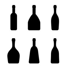 Vector silhouettes of the bottles. Simple templates. Different kinds of alcohol drinks. Black and white vector illustrations isolated on the white background. 