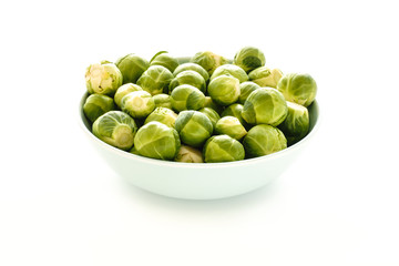 Backlit Brussels Sprouts in a Bowl on White