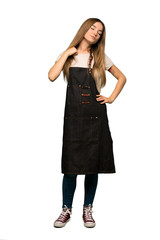 Full body Young woman with apron with tired and sick expression on isolated background
