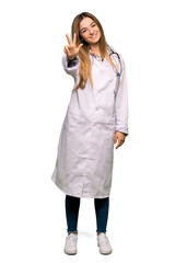 Full body Young doctor woman happy and counting three with fingers on isolated background