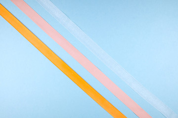 Multicolored ribbons on a blue background.