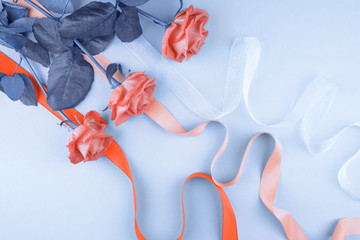 Three roses on a blue background.