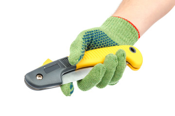 Folding garden saw in hand with glove