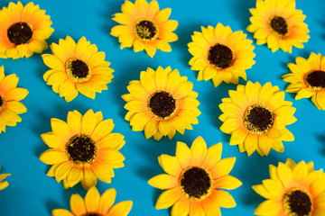 Artificial sunflowers of blue background