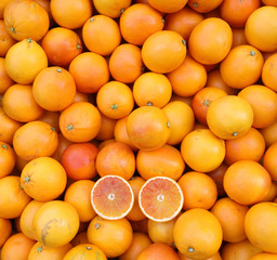 background of ripe orange oranges for sale