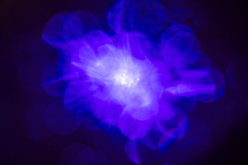 illuminated burst of blue light. lens flare shine effects. creative background