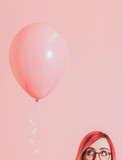 Pink haired girl with a balloon