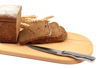 Bread on a wooden board isolated on white background