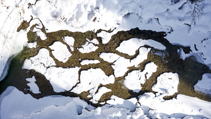 snow covered river delta aerial in 4k