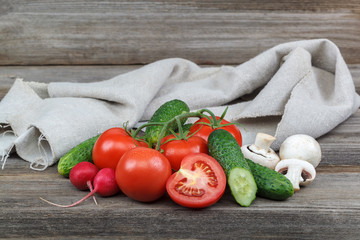 Fresh vegetables on a cutting board with a knife