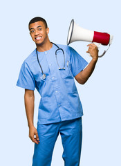 Surgeon doctor man taking a megaphone that makes a lot of noise on isolated background