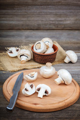 Fresh fruits of mushrooms on a wooden board