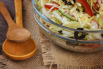 Fresh vegetables and vegetable salad in dishes