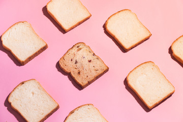 Sliced bread to toast isolated on pink background. Close up. Top view