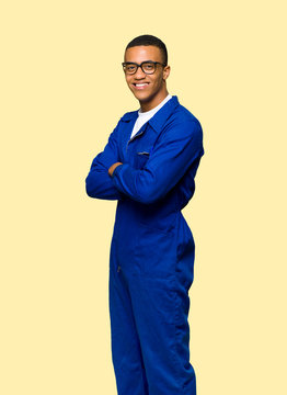 Young Afro American Worker Man With Glasses And Happy On Isolated Background