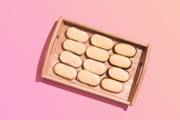 Cat's tongue cookie served on Wooden Tray