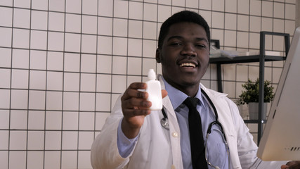 Medicaments and pharmaceutical concept - Male doctor or pharmacist holding nasal spray and saying...