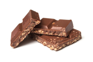 closeup of milk puffed rice chocolate blocks on white background