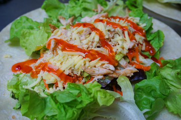Sandwich wrap with cheese shredded lettuce salad meat tomato satay sauce peanut sweet chillies sauce butter chicken delicious healthy food fast food 